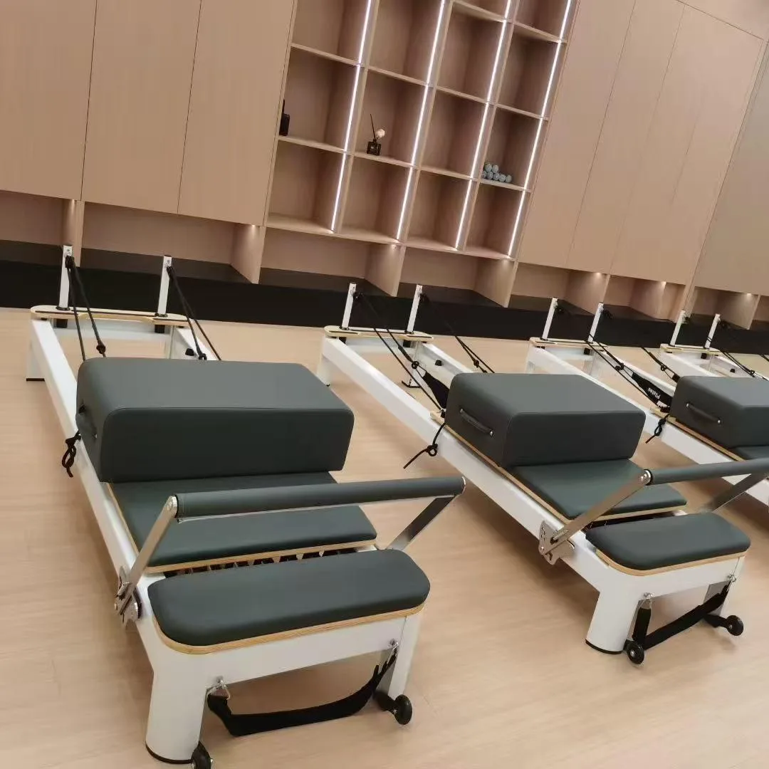 vimora reformer aluminum 4th gen white 35.webp Vimora aluminum-frame white Pilates reformer, for professional studio use