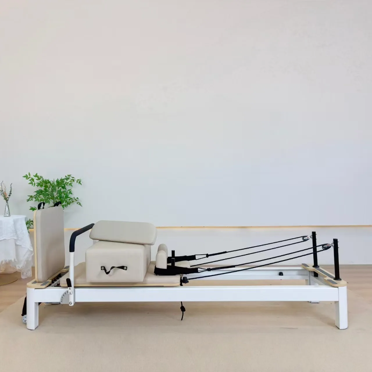 vimora reformer aluminum 4th gen white 40.webp Vimora aluminum-frame white Pilates reformer, for professional studio use