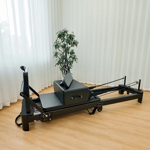 vimora reformer aluminum folding white 02.webp Vimora aluminum-frame white folding Pilates reformer, for professional studio use