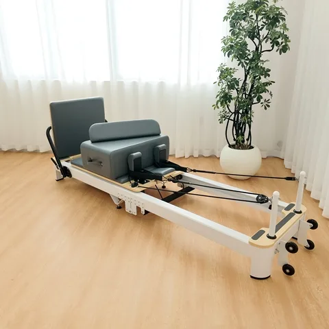 vimora reformer aluminum folding white 05.webp Vimora aluminum-frame white folding Pilates reformer, for professional studio use