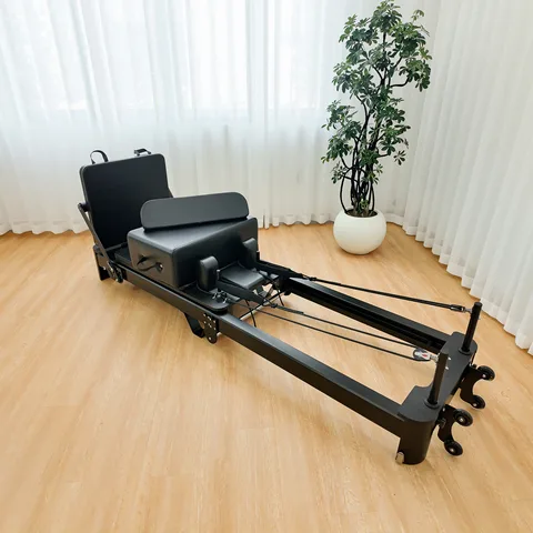 vimora reformer aluminum folding white 09.webp Vimora aluminum-frame white folding Pilates reformer, for professional studio use