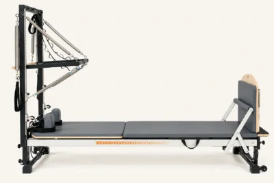 Vimora aluminum-frame Merrithew-style Pilates reformer with half tower, for professional studio use