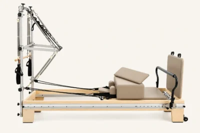 Vimora maple wood BASI-style full track Pilates reformer with half tower, for professional studio use