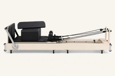 Vimora maple wood folding Pilates reformer with steel legs, for professional studio use