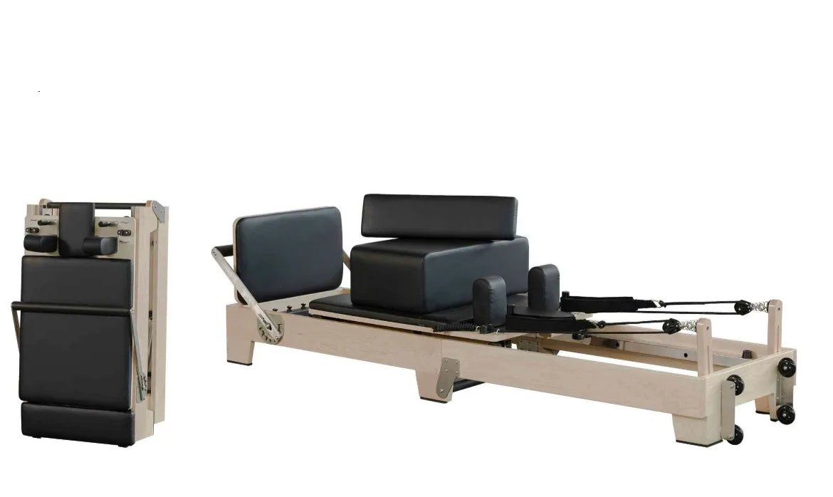 vimora reformer maple folding wooden legs 08.webp Vimora maple wood folding Pilates reformer with wooden legs, for professional studio use