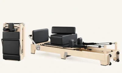 Vimora maple wood folding Pilates reformer with wooden legs, for professional studio use