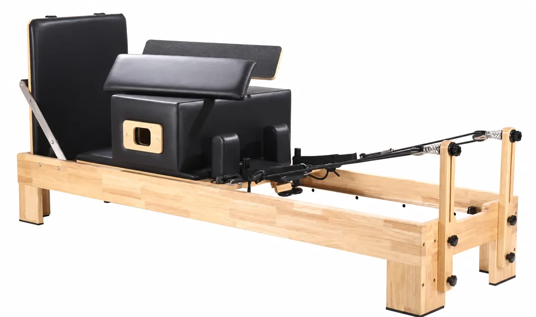vimora reformer oak built in footbar 02.webp Vimora oak wood Pilates reformer with built-in footbar, for professional studio use