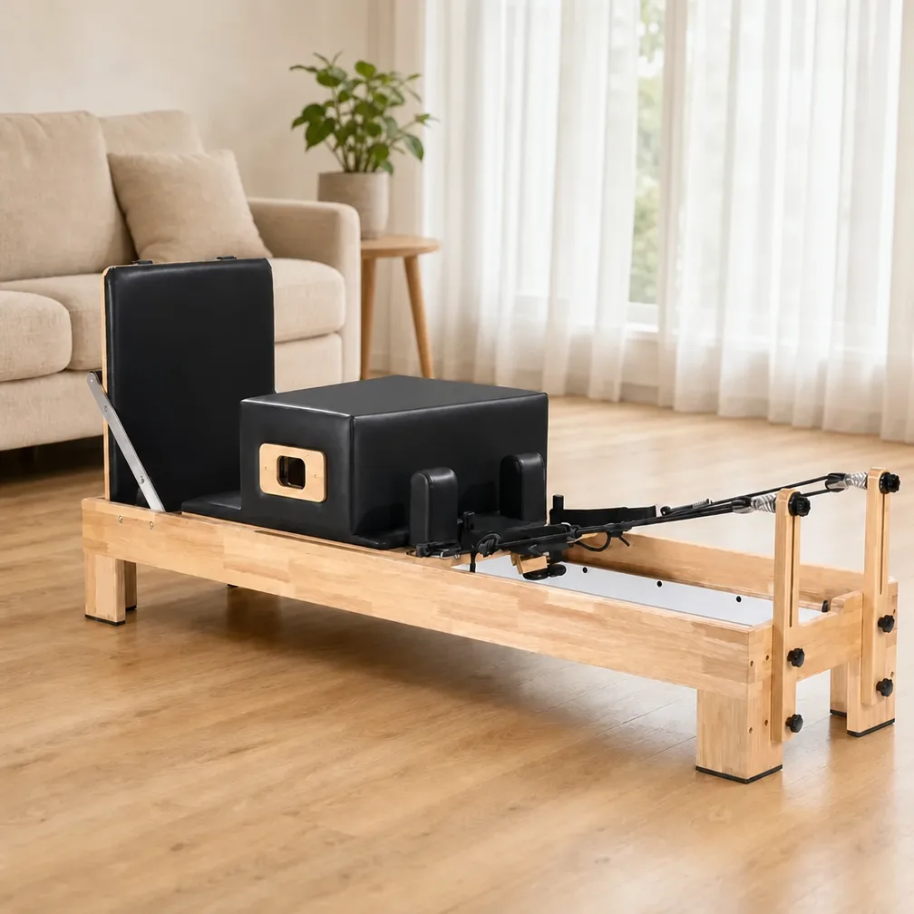 vimora reformer oak built in footbar 03.webp Vimora oak wood Pilates reformer with built-in footbar, for professional studio use