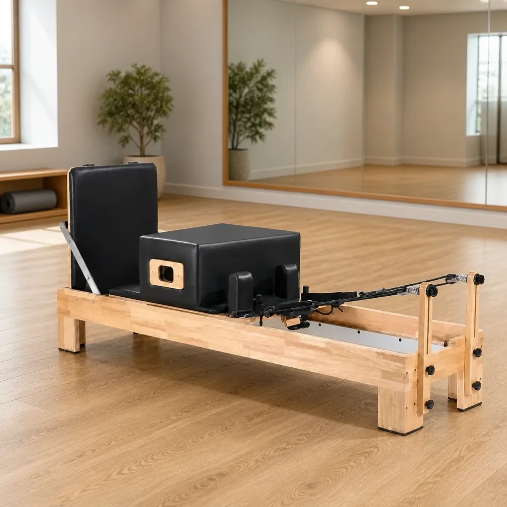 vimora reformer oak built in footbar 04.webp Vimora oak wood Pilates reformer with built-in footbar, for professional studio use