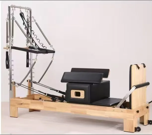 vimora reformer oak built in footbar half tower 02.webp Vimora oak wood Pilates reformer with built-in footbar with half tower, for professional studio use