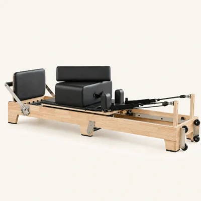 Vimora oak wood folding Pilates reformer with wooden legs, for professional studio use